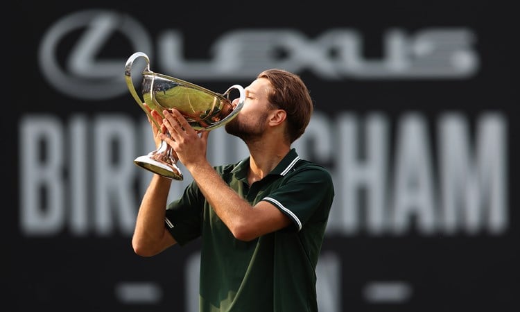 Otto Virtanen kisses the trophy after winning the Lexus Birmingham Open