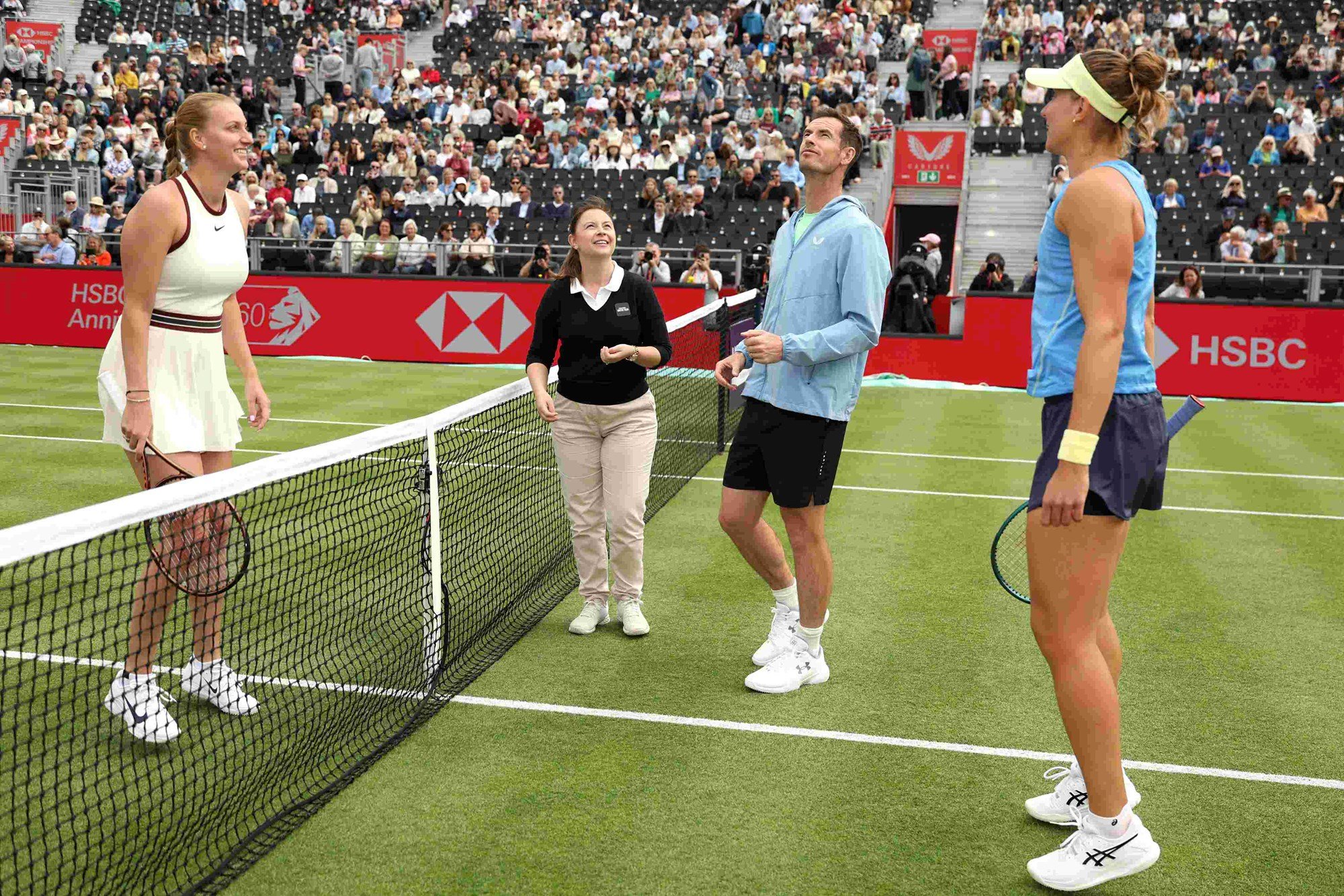 Andy Murray stood on court at the HSBC Championships doing the coin toss for Beatriz Haddad Maia and Petra Kvitova