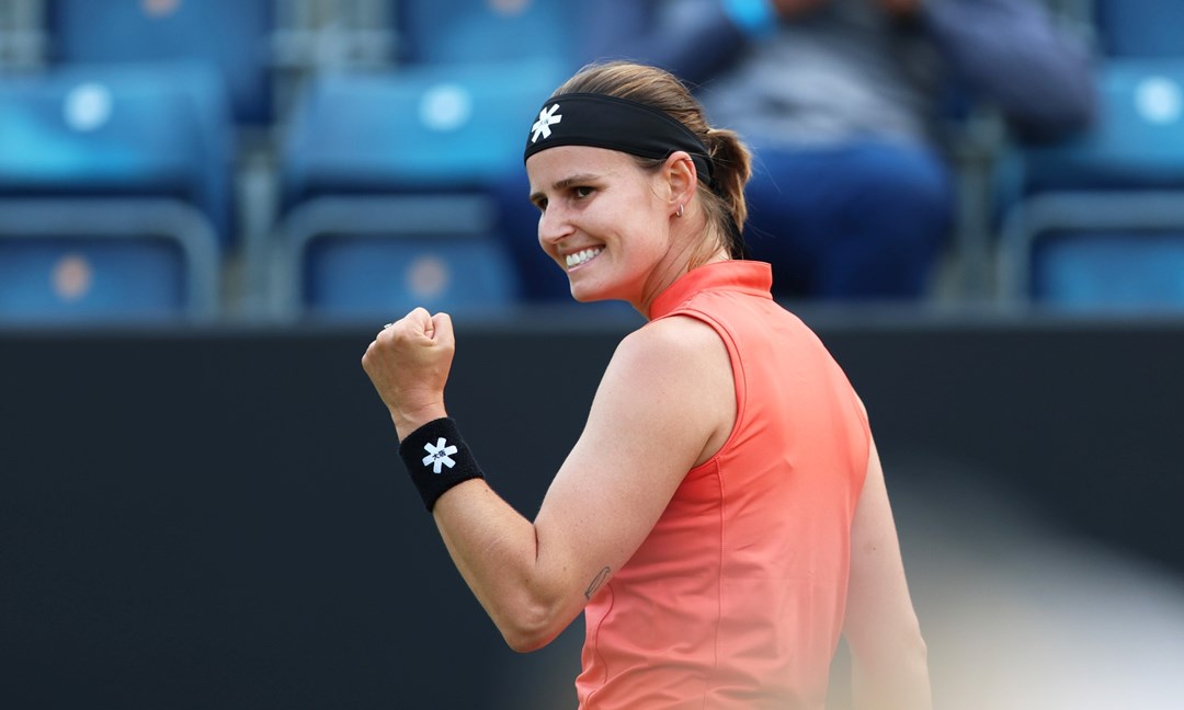 Greet Minnen celebrates winning a point during the final of the Lexus Birmingham Open
