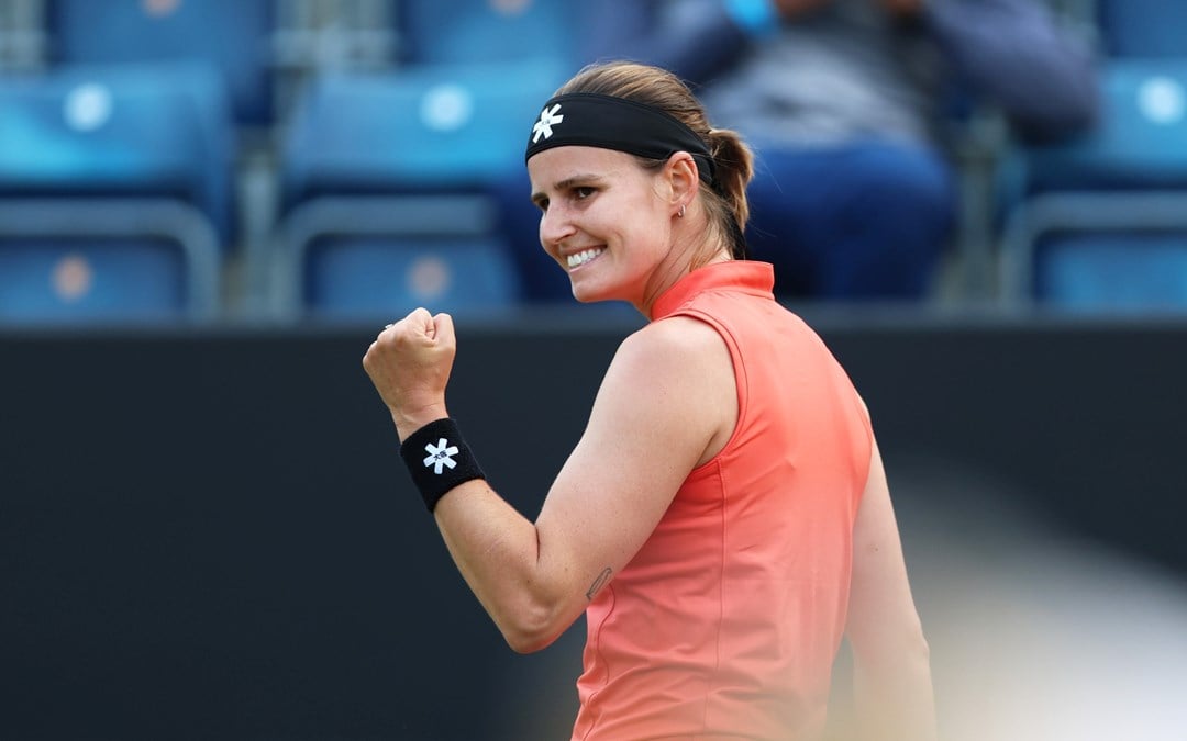 Greet Minnen celebrates winning a point during the final of the Lexus Birmingham Open