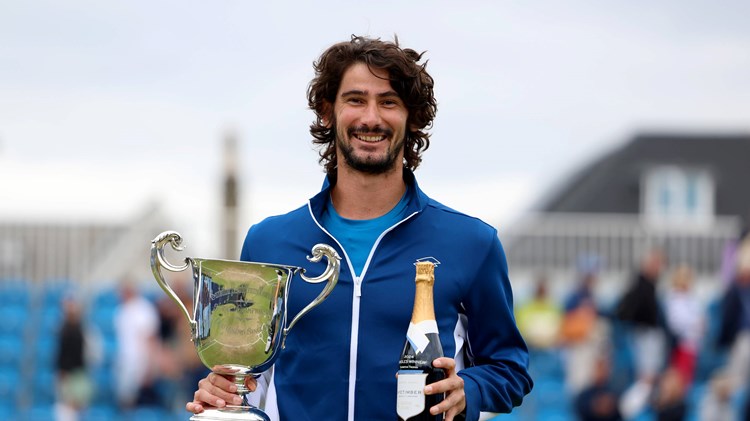 Lloyd Harris holding the Lexus Surbiton Trophy title