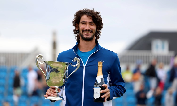 Lloyd Harris holding the Lexus Surbiton Trophy title