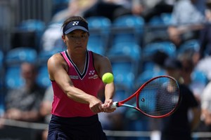 Lily Miyazaki hitting a backhand on court at the Lexus Surbiton Trophy