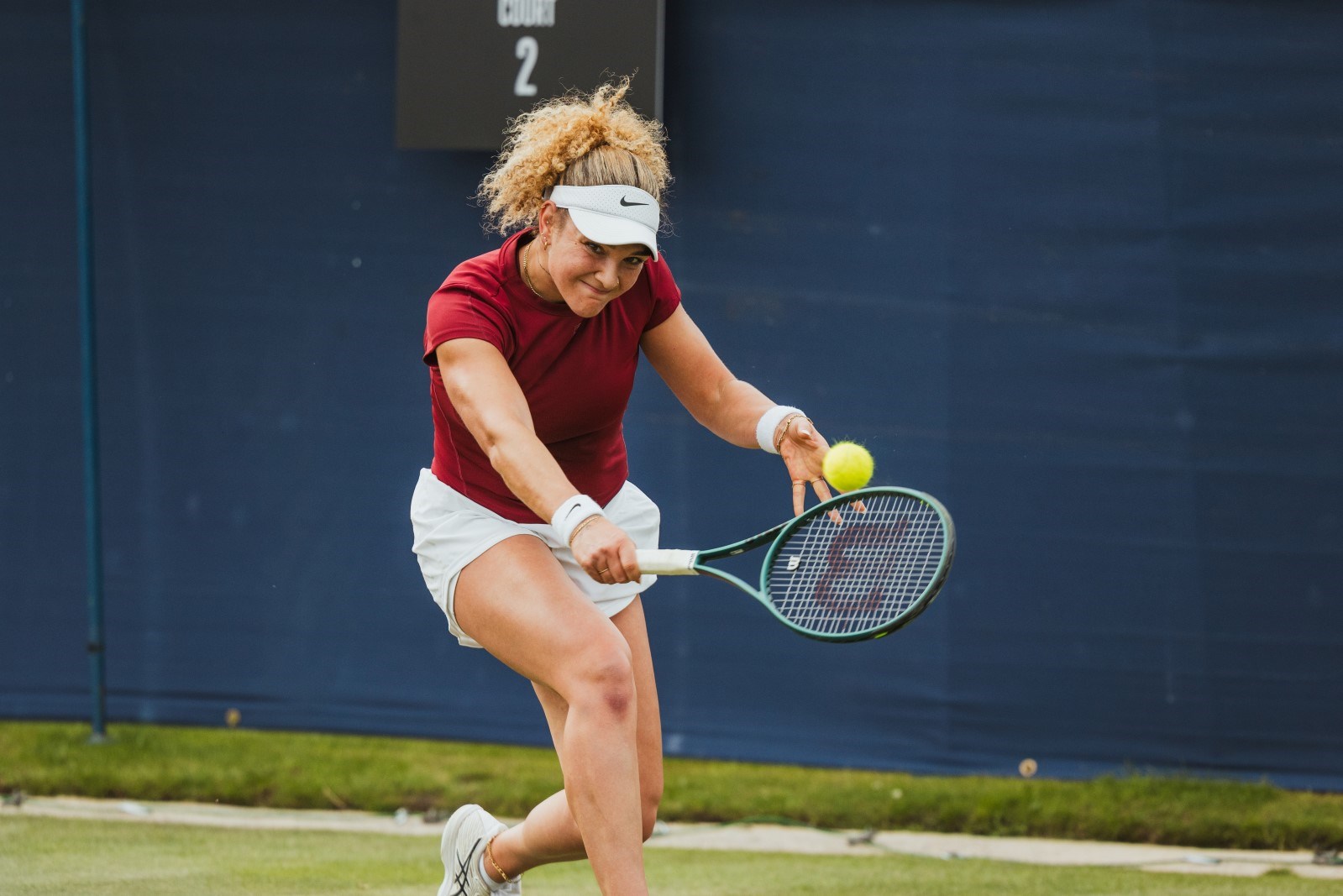 Amarni Banks hitting a backhand at the Lexus Ilkley Open