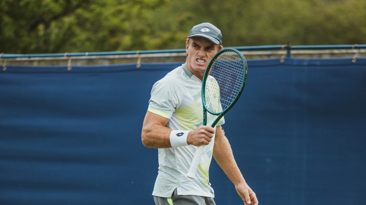 Tristian Schoolkate pumps his racket in celebration at the Lexus Ilkley Open