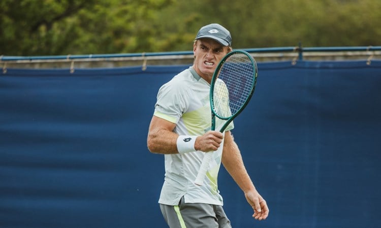 Tristian Schoolkate pumps his racket in celebration at the Lexus Ilkley Open