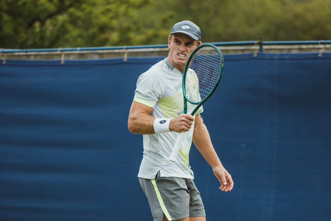 Tristian Schoolkate pumps his racket in celebration at the Lexus Ilkley Open