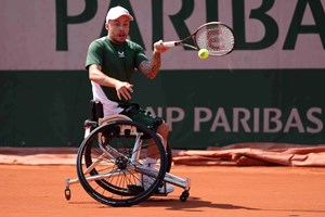 Wheelchair tennis star Andy Lapthorne on court at Roland Garros