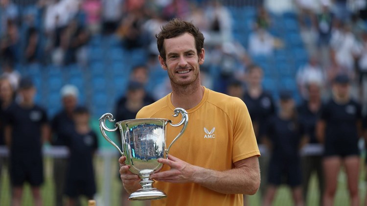 Andy Murray holding the 2023 Lexus Surbiton Trophy title
