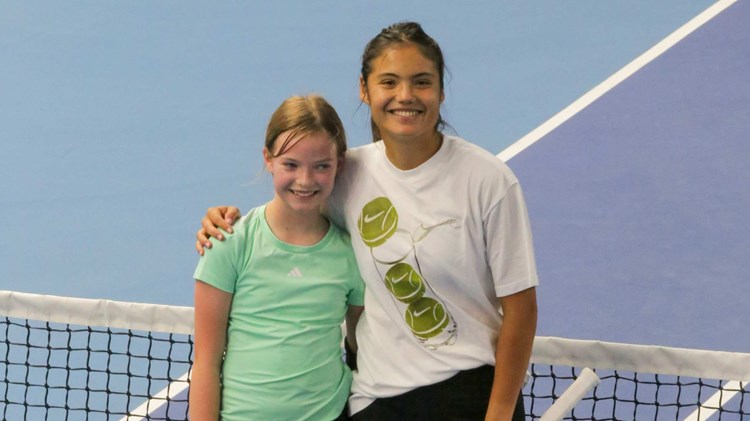 Emma Raducanu stood next to 11-year-old Joanie at the net at the National Tennis Centre