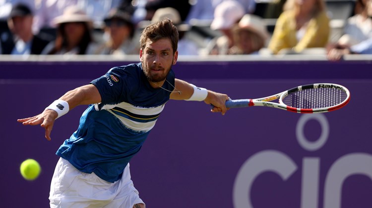 Cam Norrie playing a forehand during his first round match at the 2022 cinch Championships