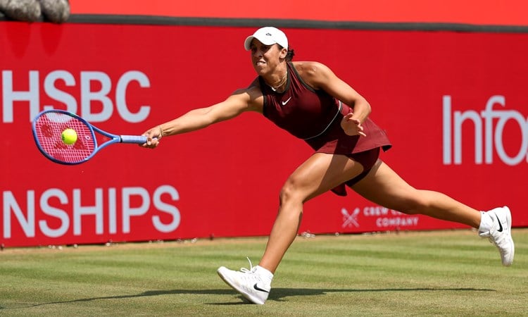 Madison Keys reaching for a forehand on the grass at the HSBC Championships