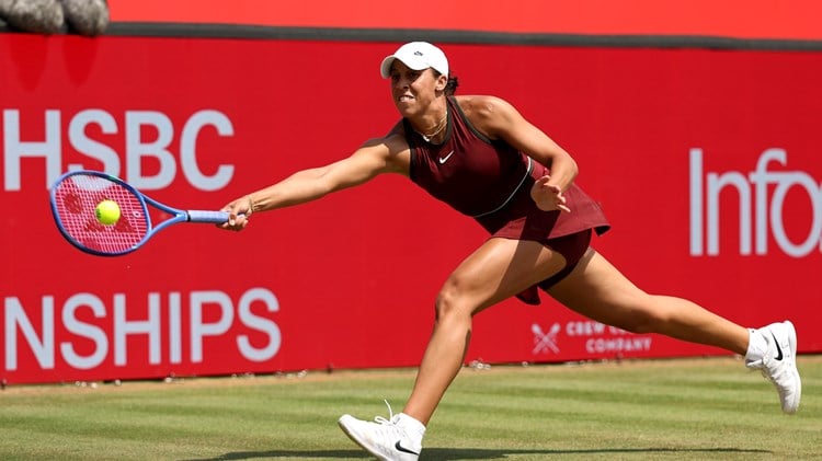 Madison Keys reaching for a forehand on the grass at the HSBC Championships