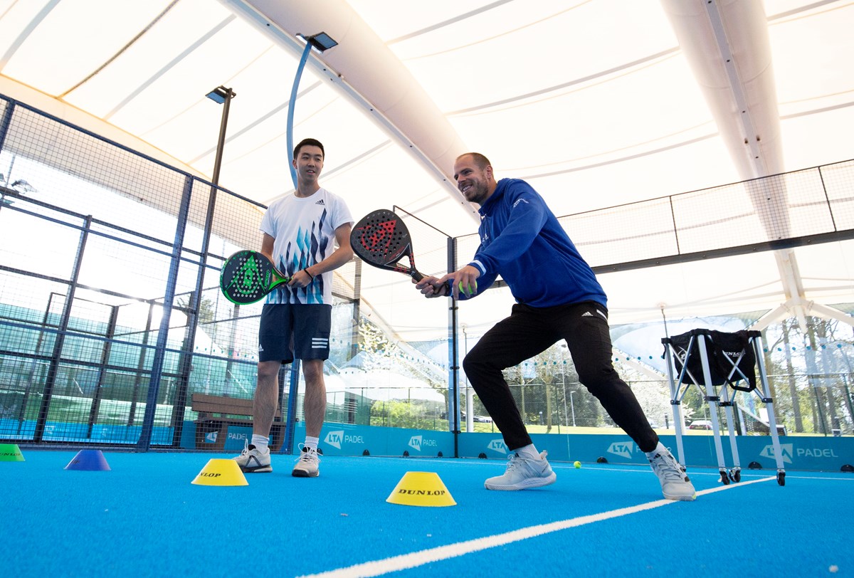 padel-coach-teaching-man-forehand.jpg