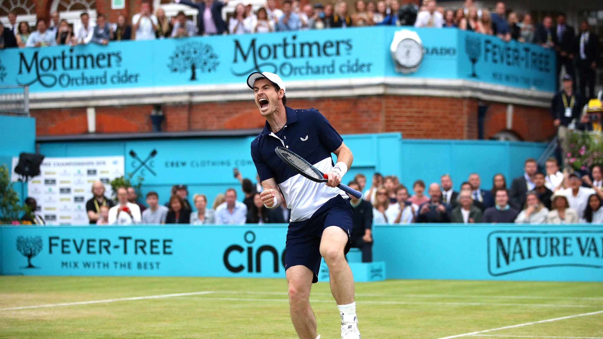 Andy Murray celebrates winning the doubles at the 2019 Queen's Club Championships