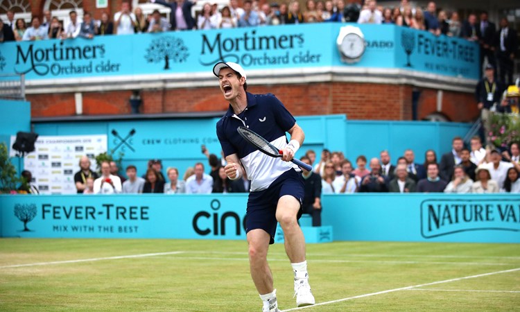Andy Murray celebrates winning the doubles at the 2019 Queen's Club Championships