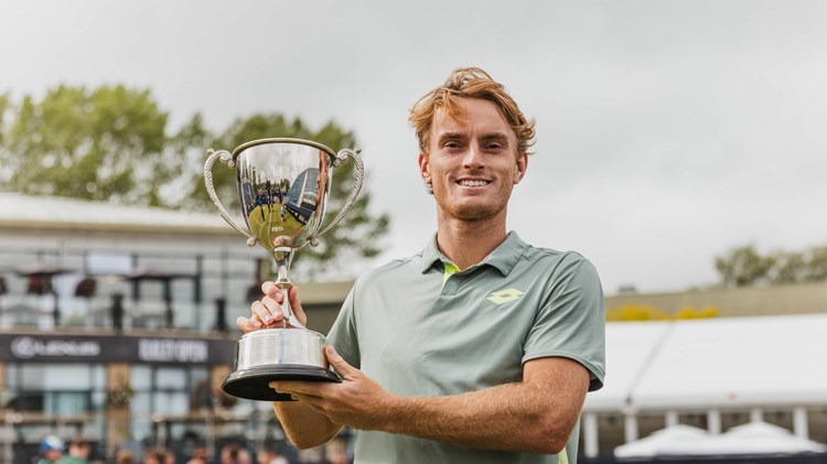 Tristan Schoolkate holding the Lexus Ilkley Open trophy