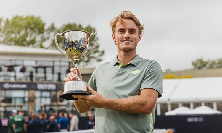Tristan Schoolkate holding the Lexus Ilkley Open trophy