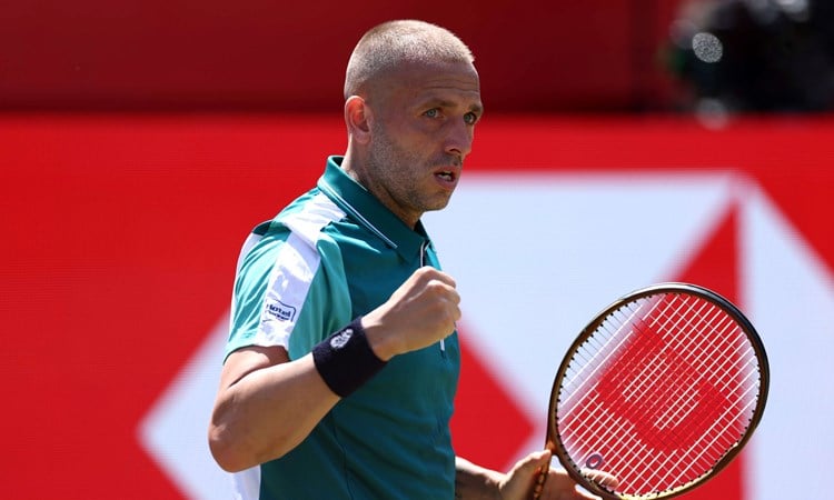 Dan Evans celebrates winning a point against Frances Tiafoe at the HSBC Championships