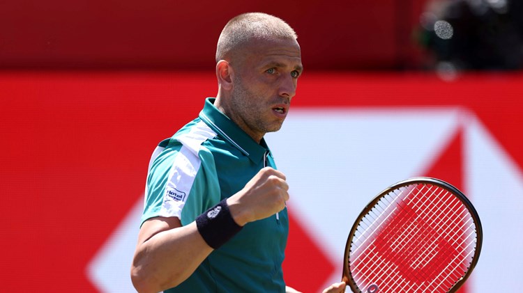 Dan Evans celebrates winning a point against Frances Tiafoe at the HSBC Championships
