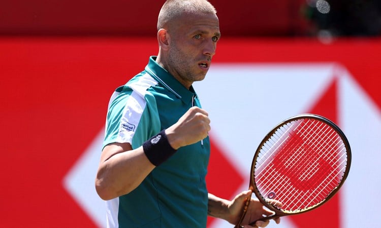 Dan Evans celebrates winning a point against Frances Tiafoe at the HSBC Championships