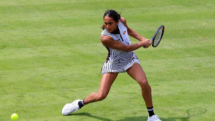 Naiktha Bains returning a backhand during her opening qualifier match against Romania's Ana Bogdan at the 2023 Rothesay Classic Birmingham 