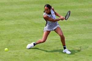 Naiktha Bains returning a backhand during her opening qualifier match against Romania's Ana Bogdan at the 2023 Rothesay Classic Birmingham 