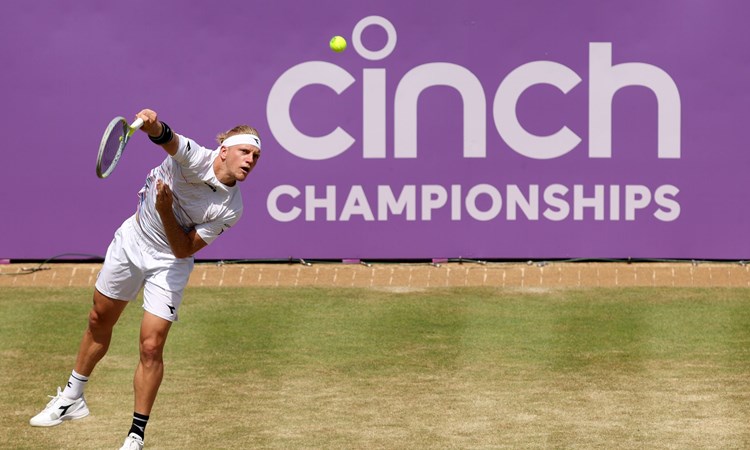 Davidovich Fokina hitting a serve at Queen's