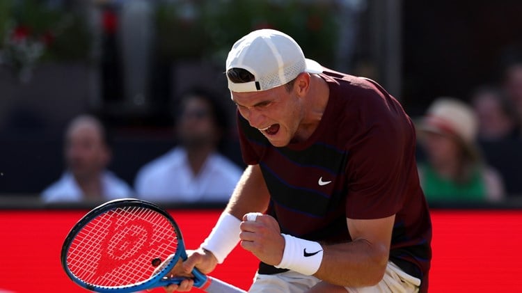 Jack Draper cheers and fist pumps in celebration on the Andy Murray Arena