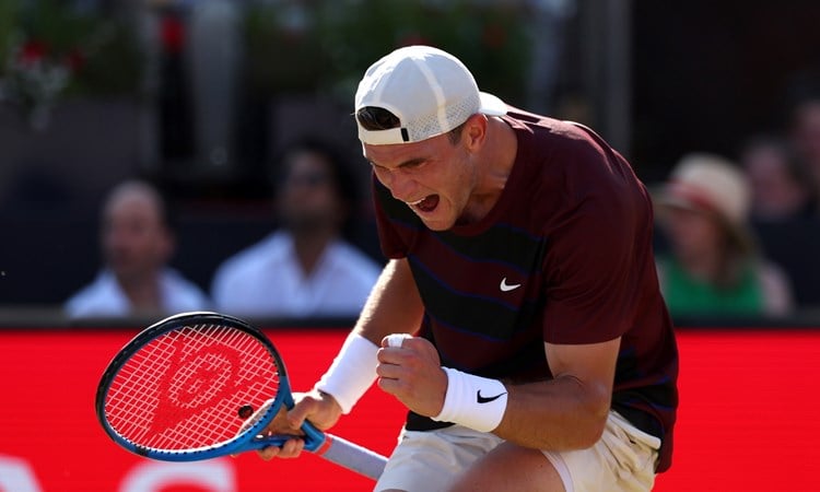 Jack Draper cheers and fist pumps in celebration on the Andy Murray Arena