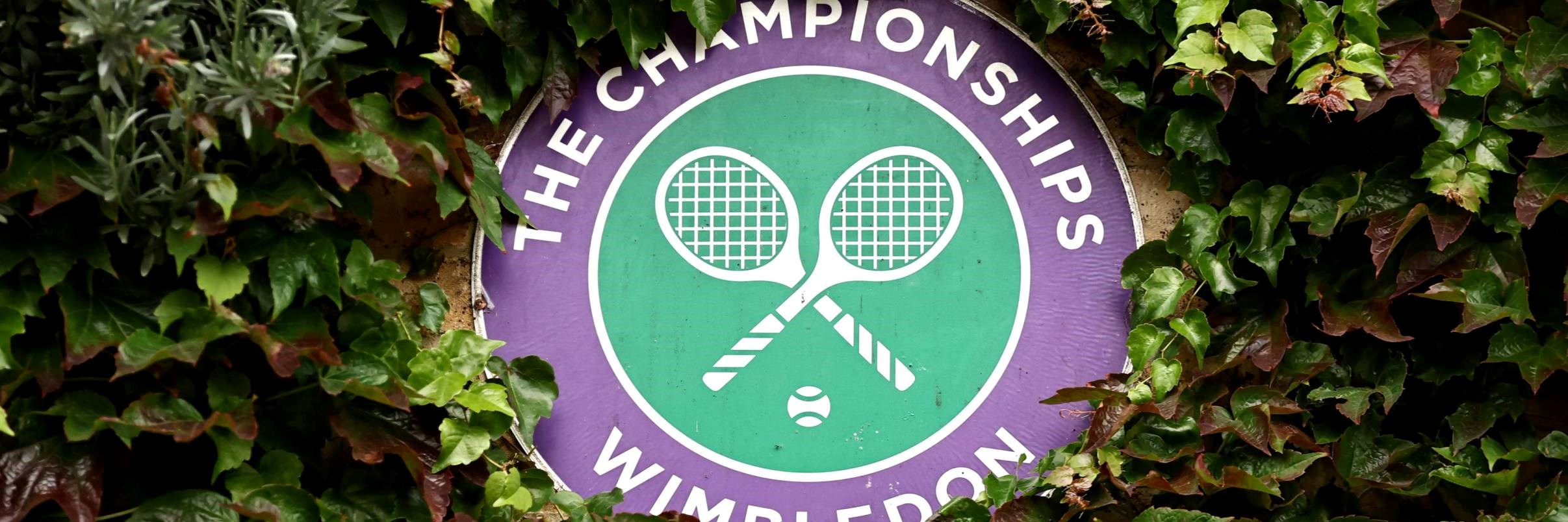Wimbledon logo decoratively placed in a bush