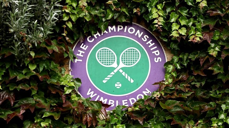 Wimbledon logo decoratively placed in a bush