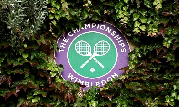 Wimbledon logo decoratively placed in a bush