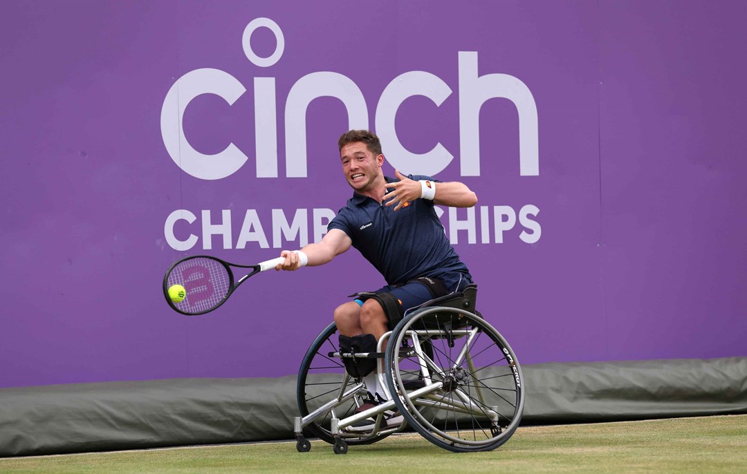 Wheelchair tennis player Alfie Hewett stretches to hit a forehand on court at the cinch Championships