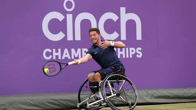 Wheelchair tennis player Alfie Hewett stretches to hit a forehand on court at the cinch Championships