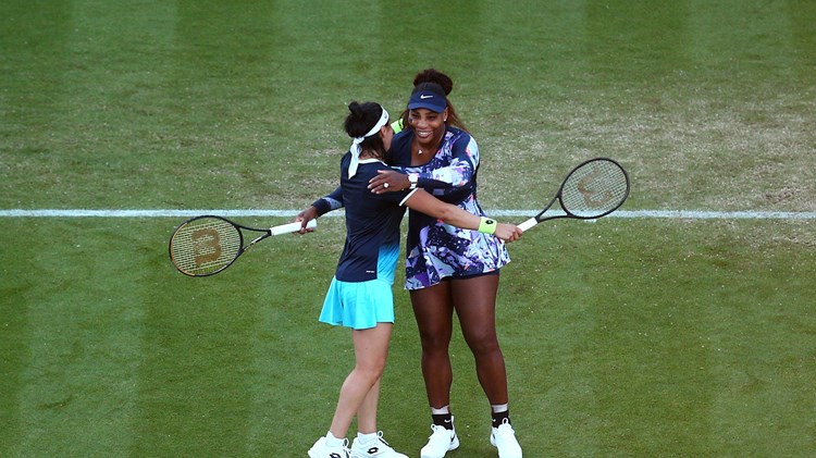 Serena Williams and Ons Jabeur embracing after winning their second round match at the Rothesay International Eastbourne
