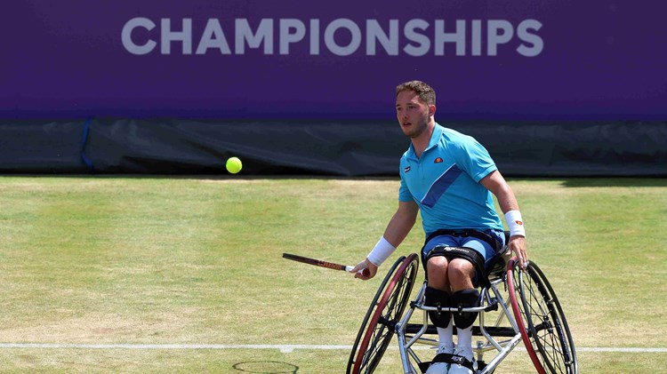 British wheelchair player Alfie Hewett hits a forehand on court at the cinch Championships