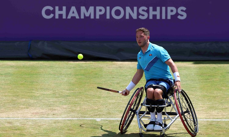 British wheelchair player Alfie Hewett hits a forehand on court at the cinch Championships