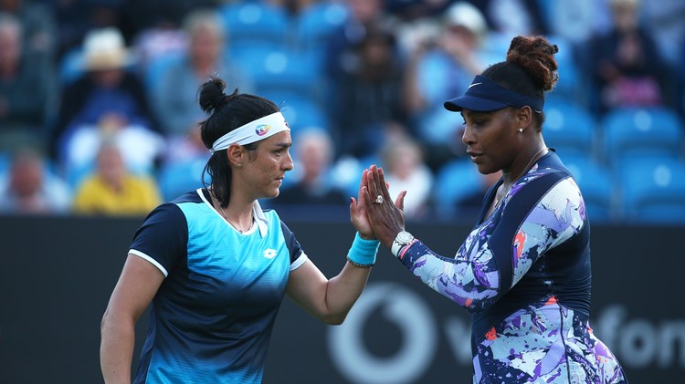 Serena Williams and Ons Jabeur high five in Eastbourne