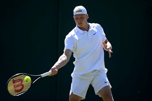 Anton Matusevich hits a forehand in Wimbledon qualifying