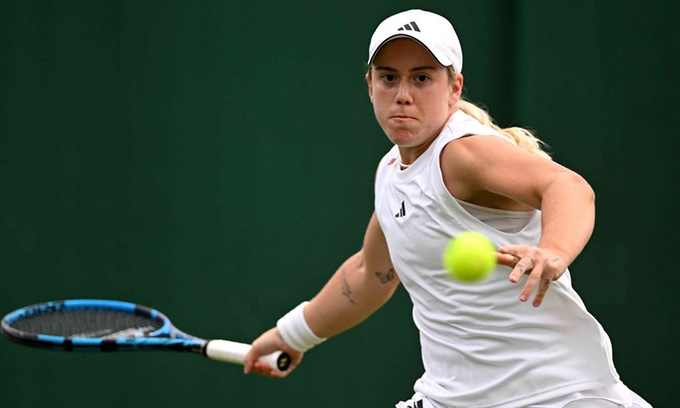 Sonay Kartal preparing to hit a forehand on court at Wimbledon during the first round