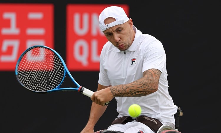Andy Lapthorne of Great Britain plays a backhand against Heath Davidson of Australia in the Men's Wheelchair Singles match during the Lexus British Open Roehampton at Wimbledon Qualifying and Community Sports Centre on July 02, 2024 in London, England.