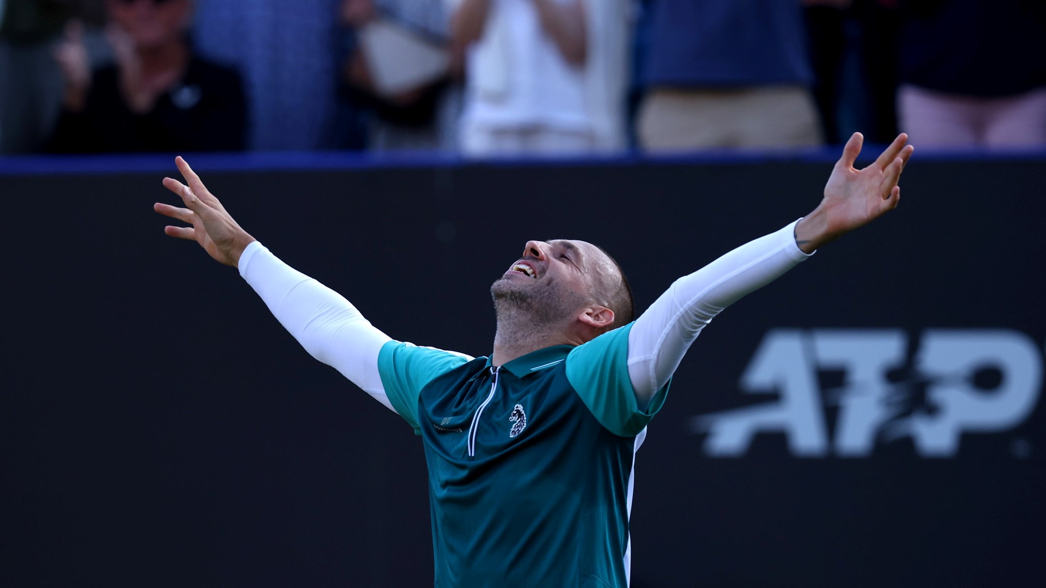 Dan Evans celebrates a second round win over Tommy Paul at the Lexus Eastbourne Open
