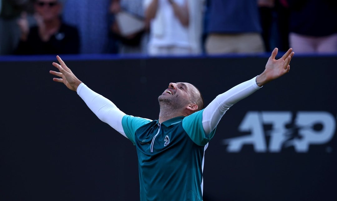 Dan Evans celebrates a second round win over Tommy Paul at the Lexus Eastbourne Open