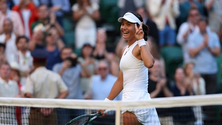 Emma Raducanu holds up the peace sign after a second round win at Wimbledon 2025