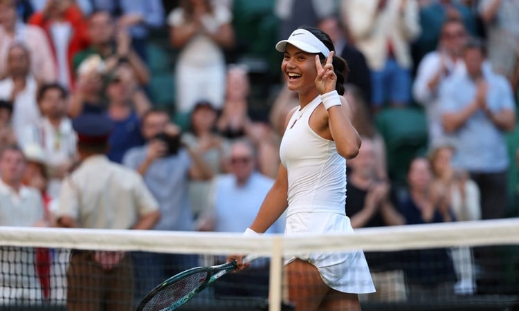 Emma Raducanu holds up the peace sign after a second round win at Wimbledon 2025