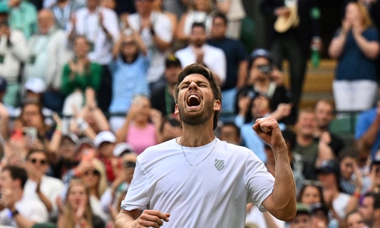 Cam Norrie cheers his fourth round win at Wimbledon