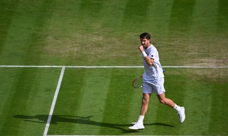 Cam Norrie fist pumps in the fourth round at Wimbledon