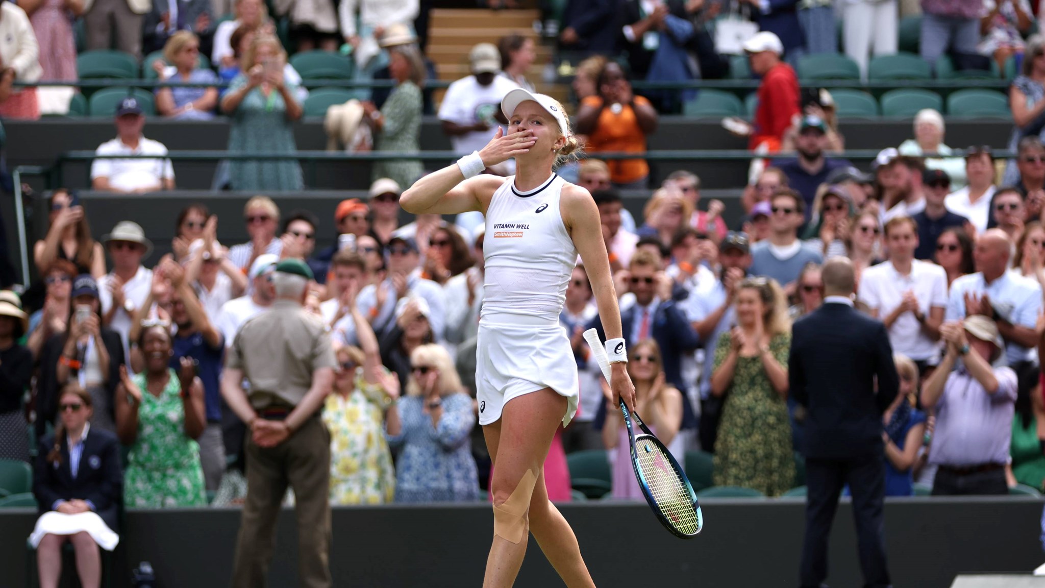 Harriet Dart sends a kiss to the crowd after beating Katie Boulter at Wimbledon