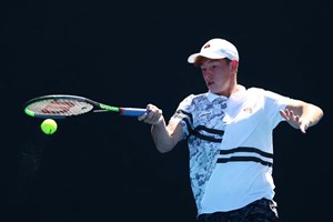 Matthew Rankin hits a forehand at the Australian Open